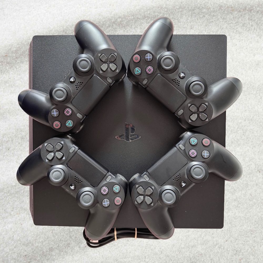 Sony PlayStation 4 Pro 1TB Bundle - 1 Console + 4 Controllers